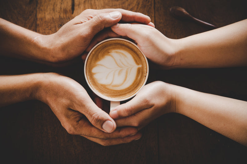A coffee passed on to someone, in person